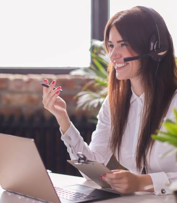 Woman working in call center as dispatcher